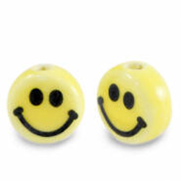 Smiley geel/zwart keramiek kraal (per stuk)