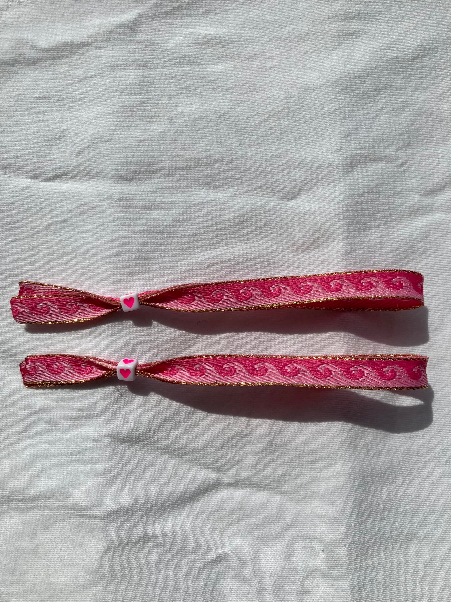 Wave pink lintarmbandje (per stuk)