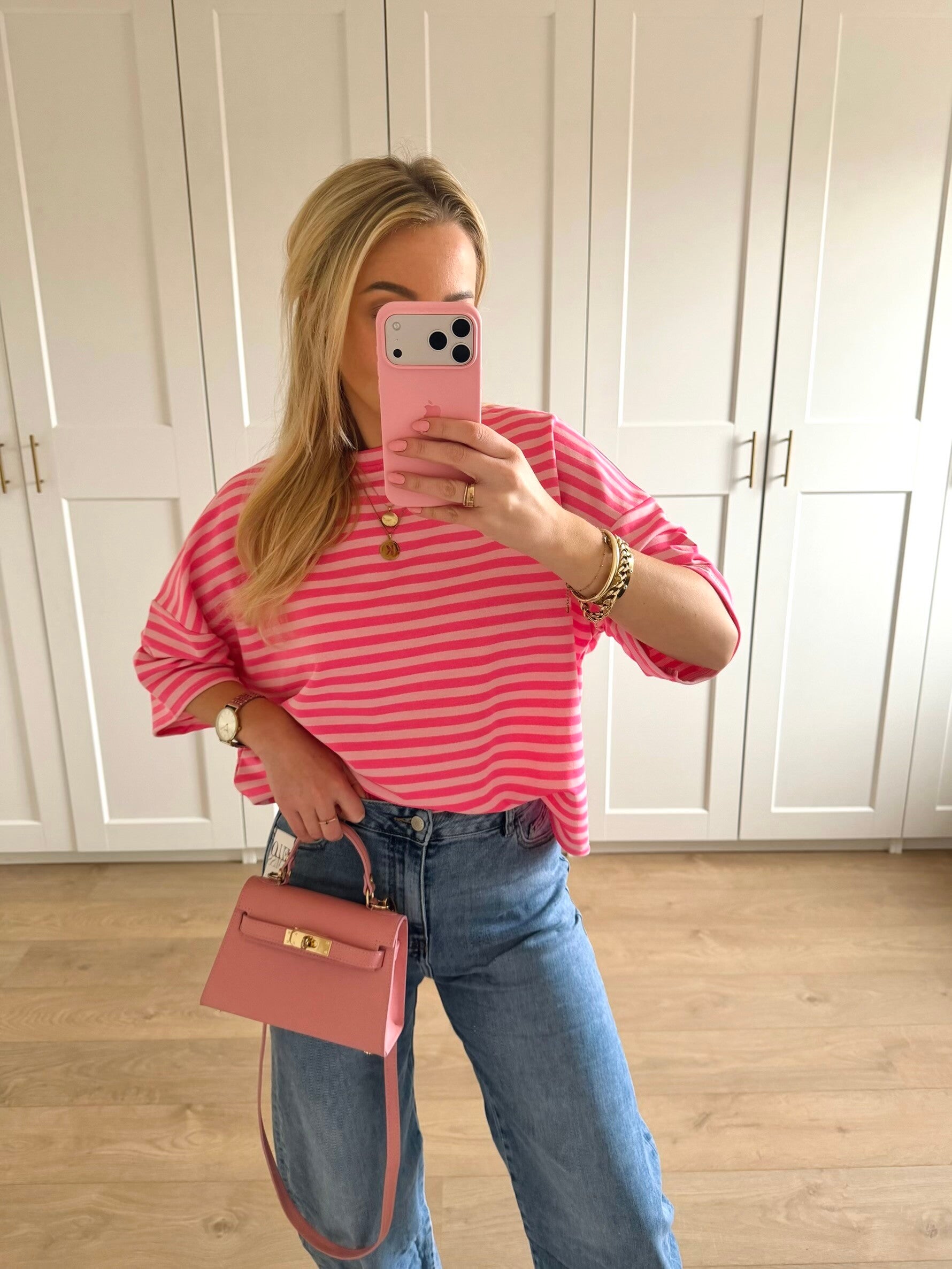 Gestreepte top met driekwart mouw - roze