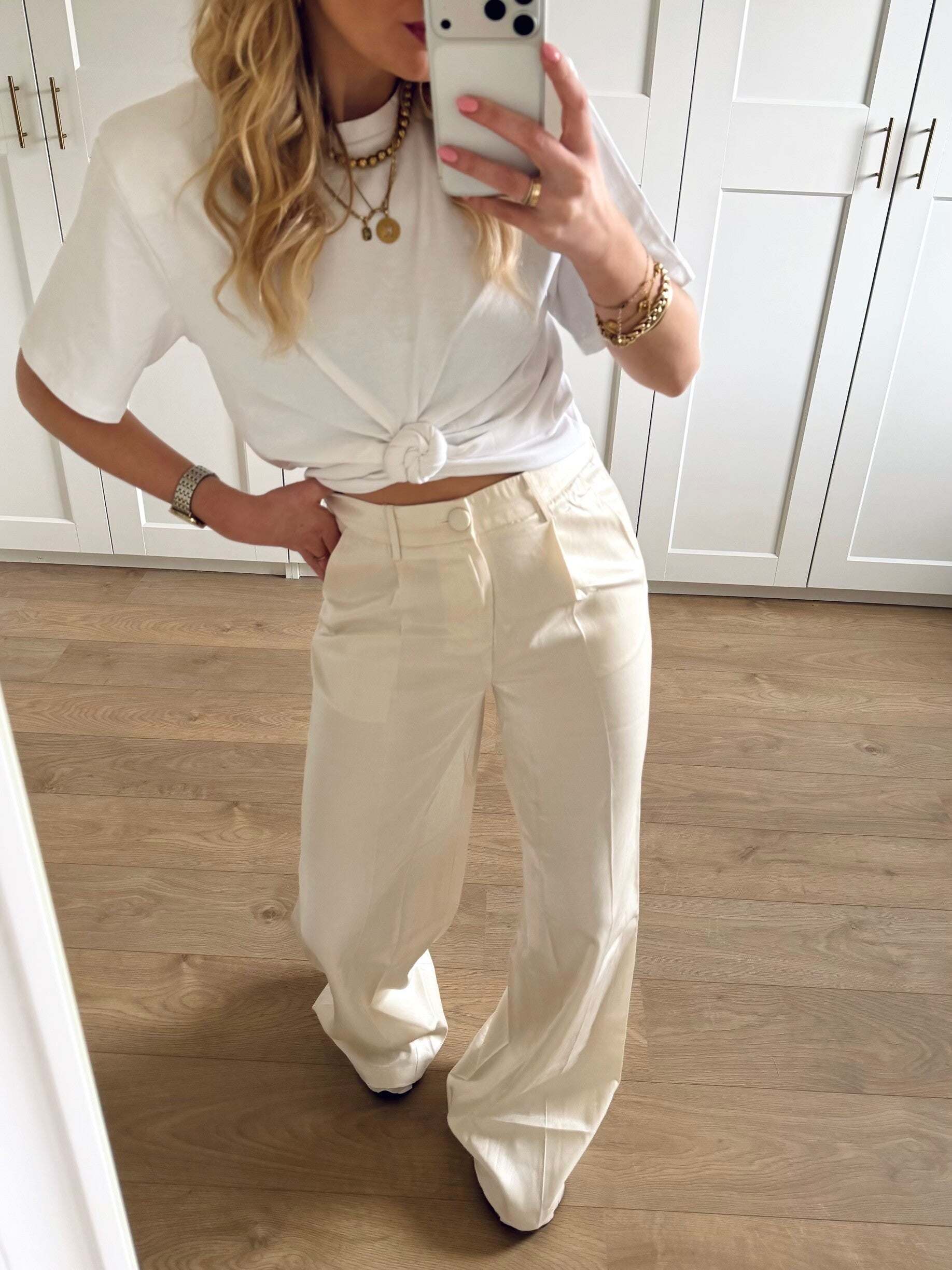 Pantalon met subtiele glittercoating - creme