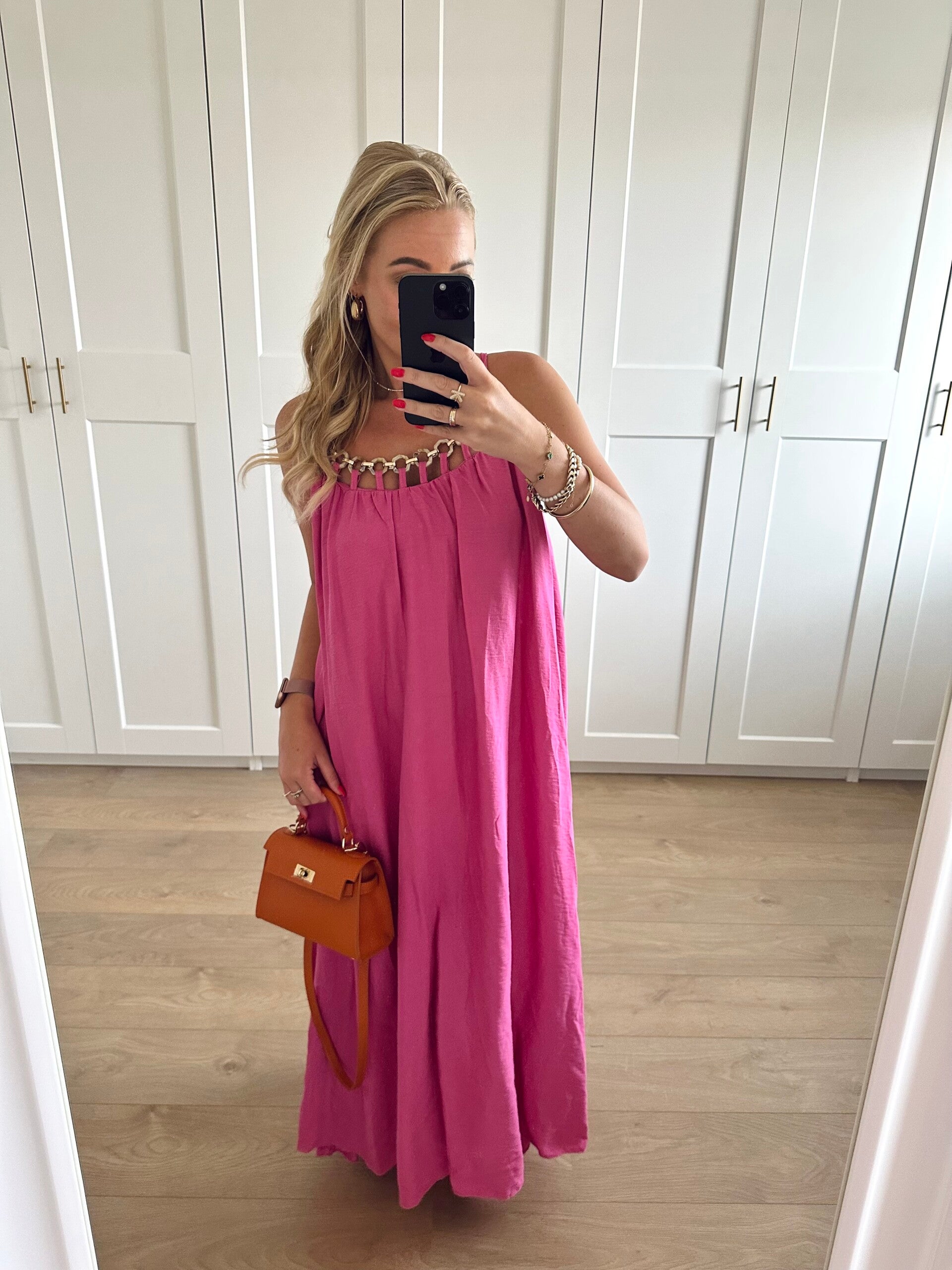 Lange jurk met sierringen - roze