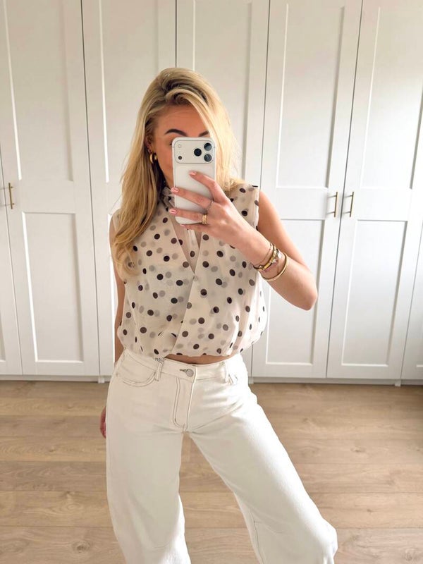 Mouwloze stippen top - wit