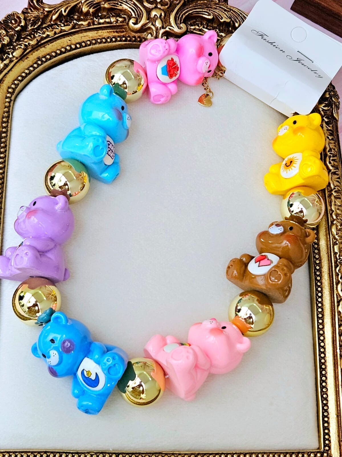 Collar ositos y bola dorada