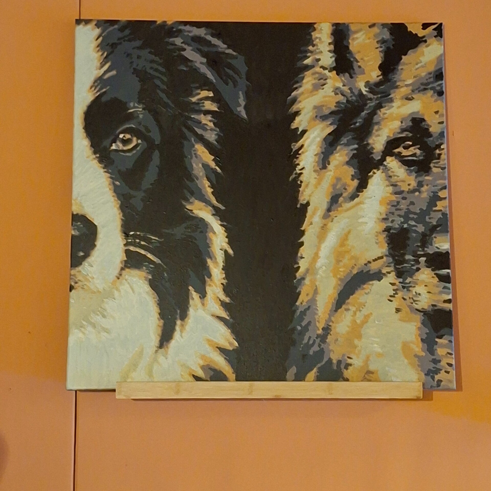 Dubbelportret van twee honden geschilderd op een doek van 70 bij 70 cm