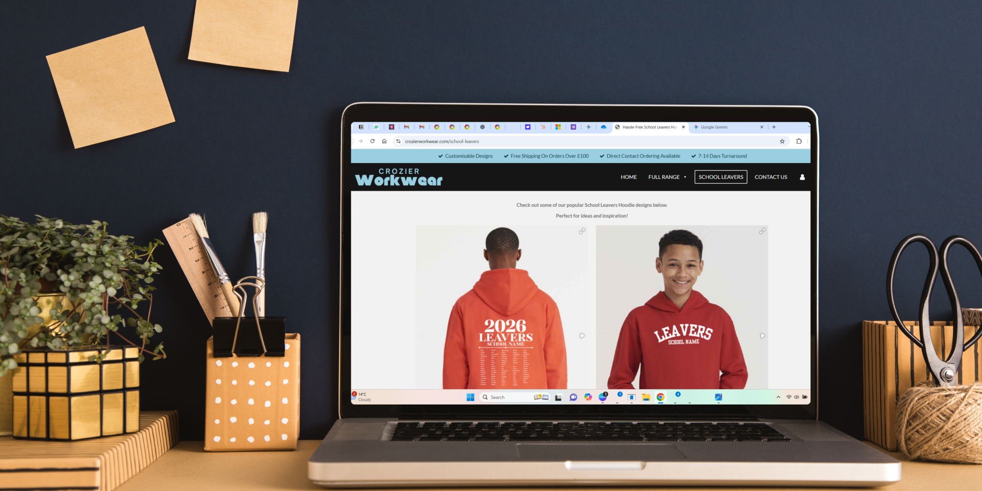 Crozier Workwear website displayed on a laptop, showcasing a School Leavers 2026 collection including an orange hoodie with a custom back names list and a red hoodie with a front 'Leavers' chest print.