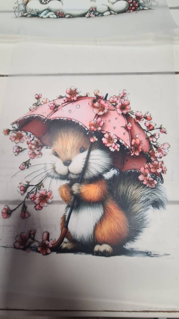 eekhoorn onder roze paaplu