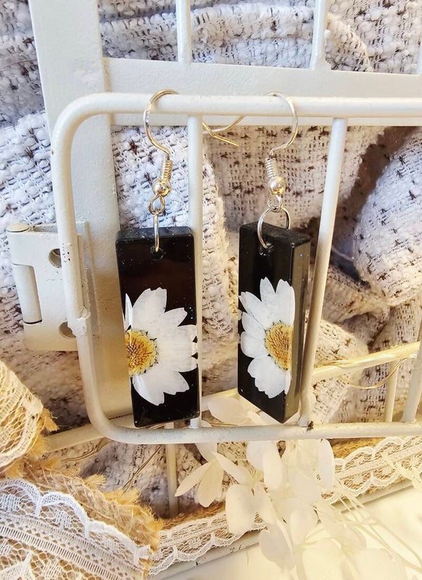 Boucles résines marguerites noires