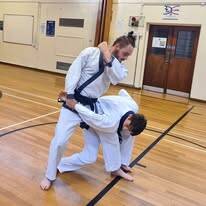 Children and Adults Training Martial Arts