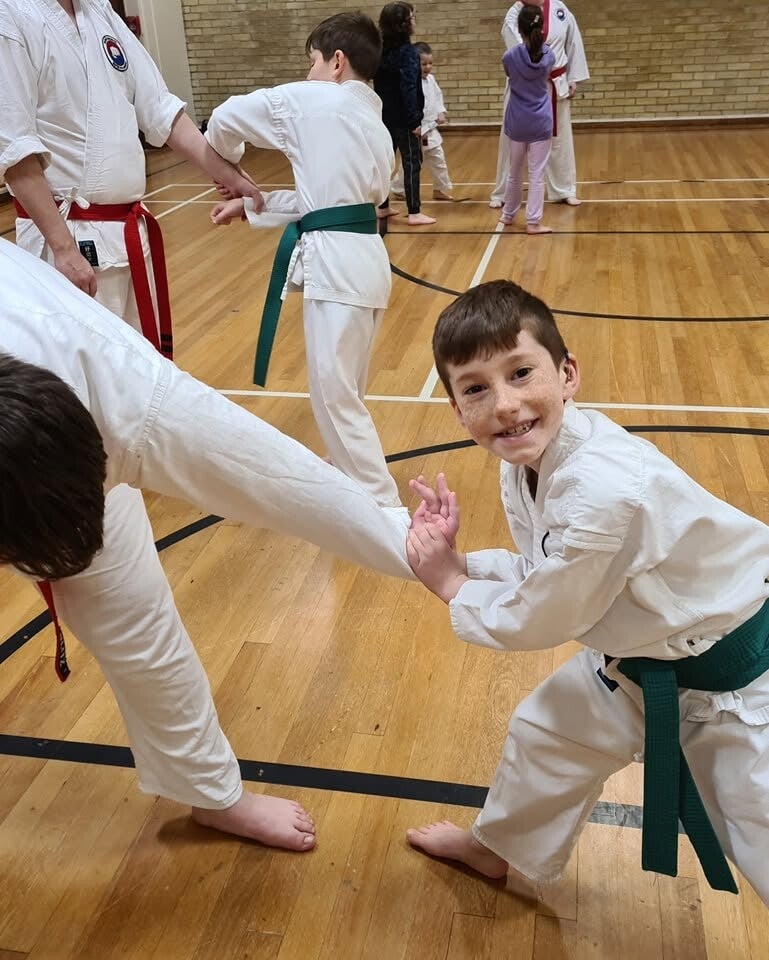 Children and Adults Training Martial Arts