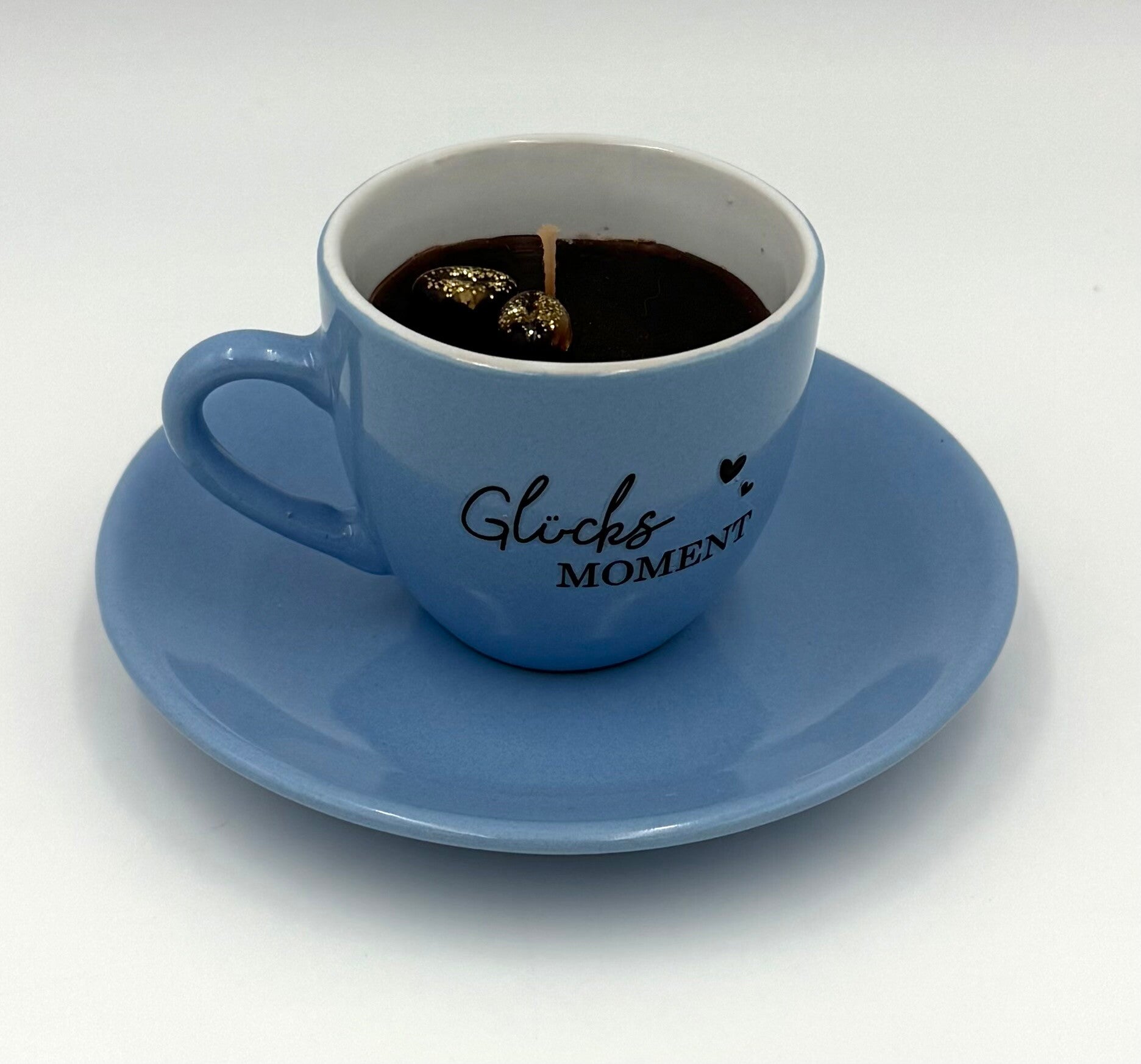 Kerze in Espressotasse mit Spruch