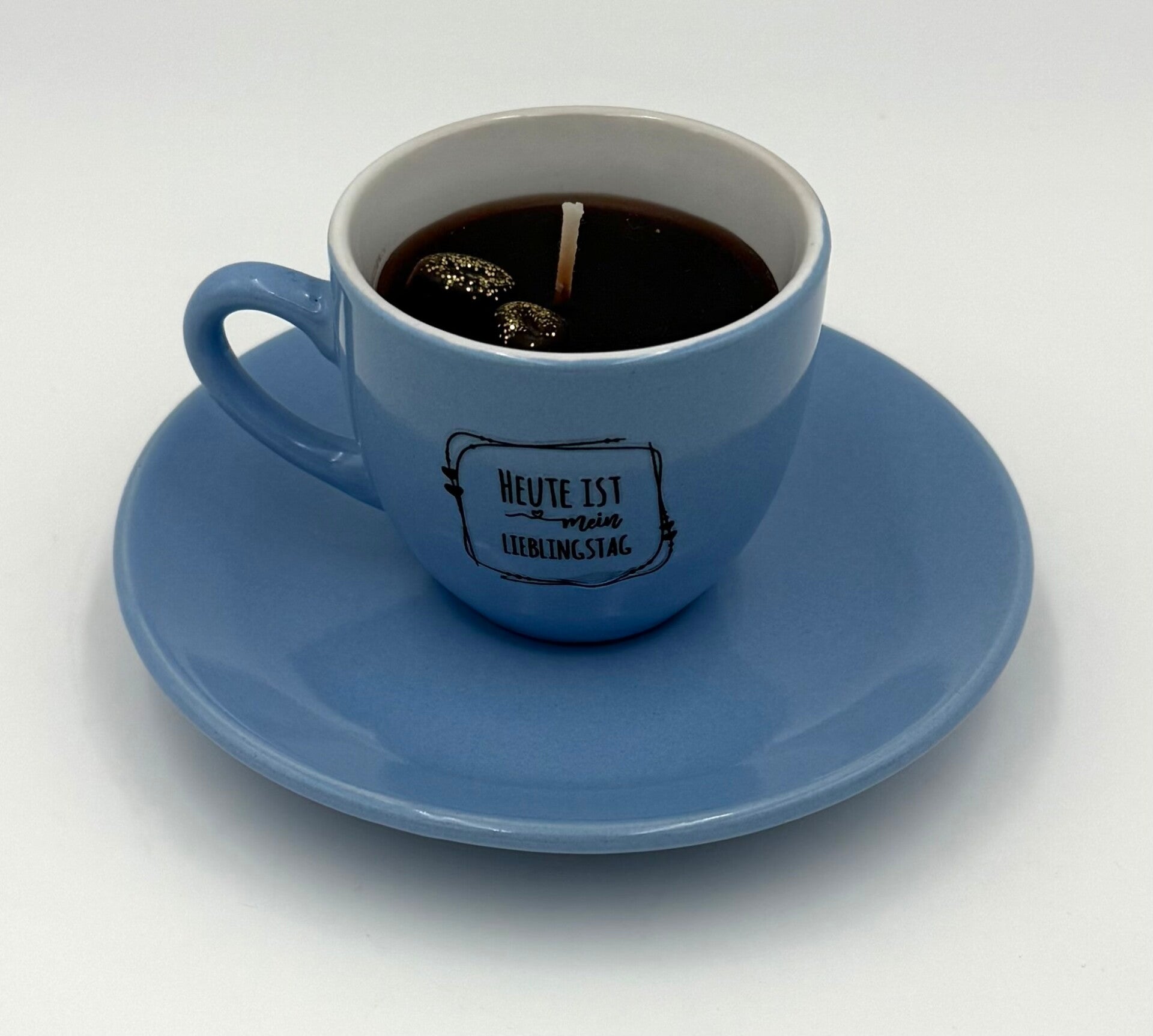 Kerze in Espressotasse mit Spruch