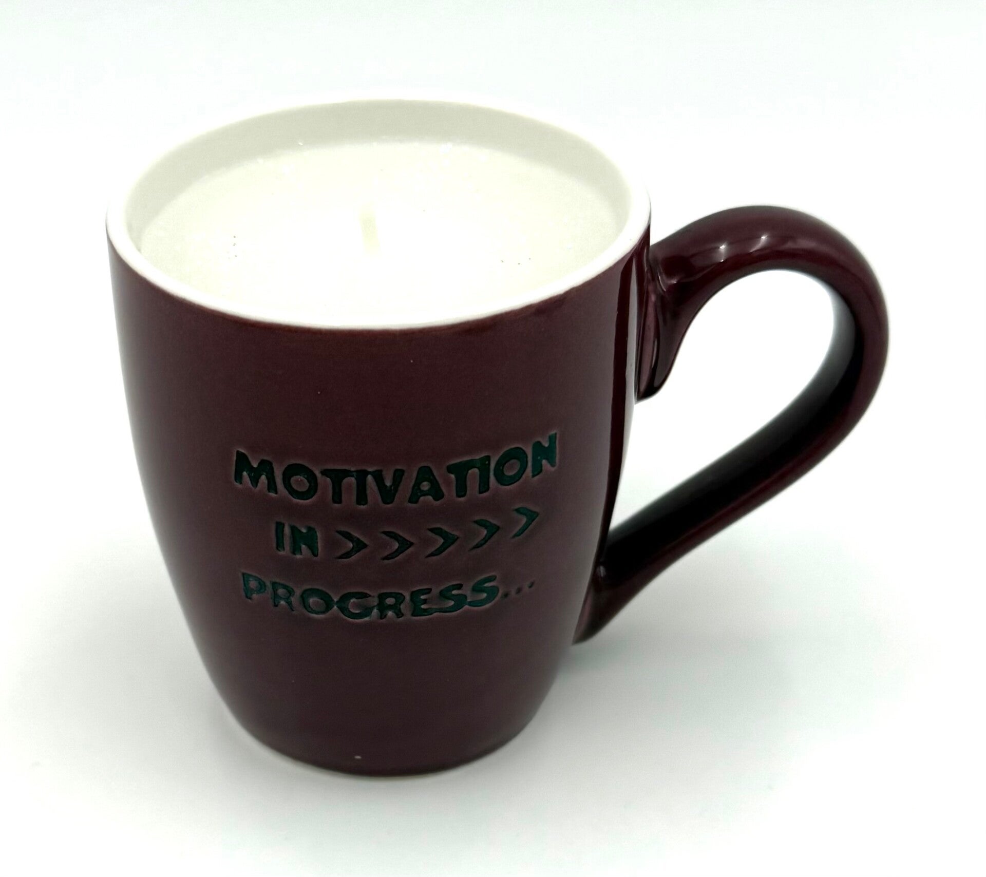 Kerze in Espressotasse mit Spruch
