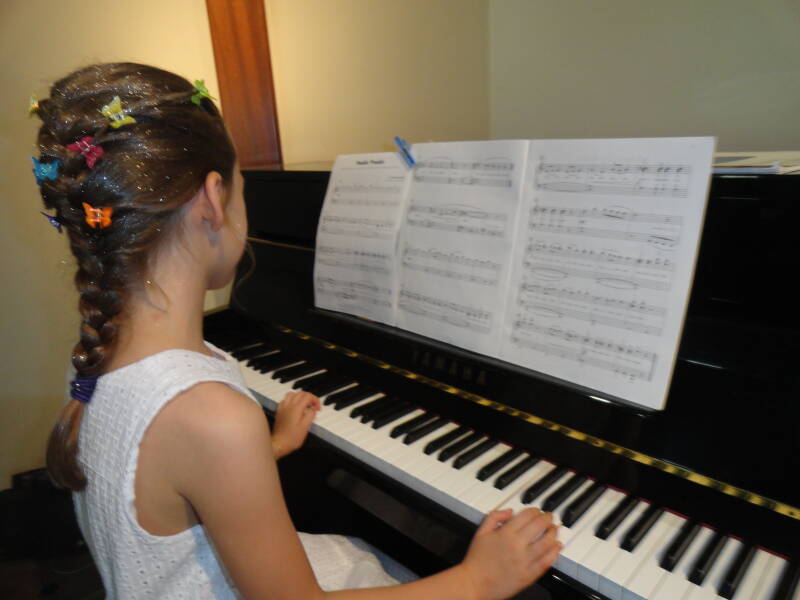 girl playing piano