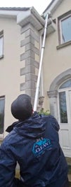 Man cleaning a facade
