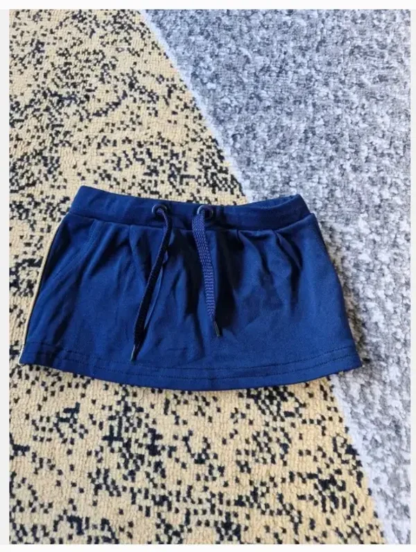 Donkerblauw rokje met goud randje maat 98