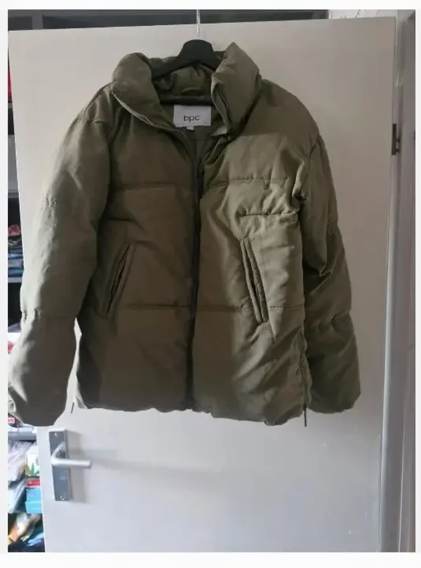 Donkergroene winterjas maat 42 (L)