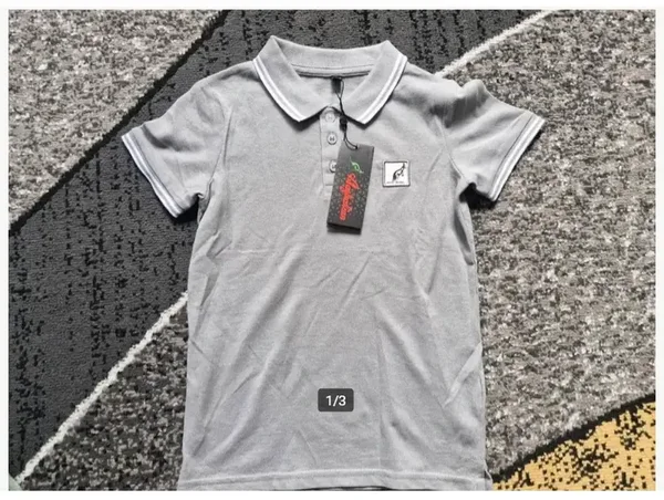 Grijze polo Maat 110-116