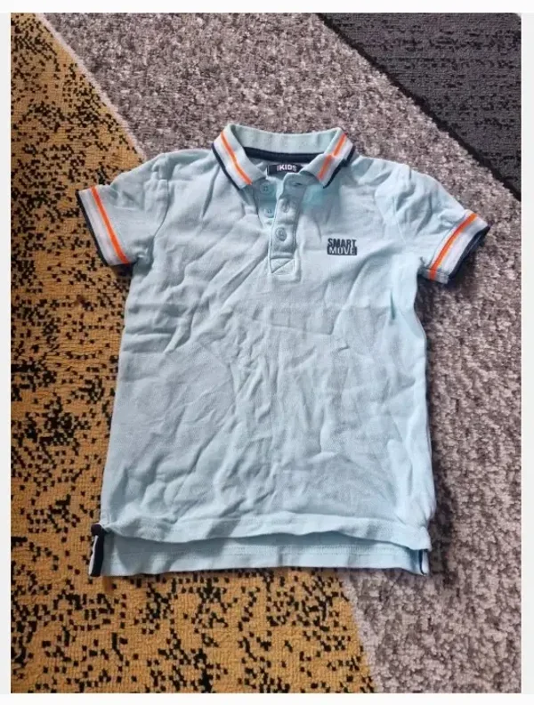 Lichtblauwe polo maat 98-104
