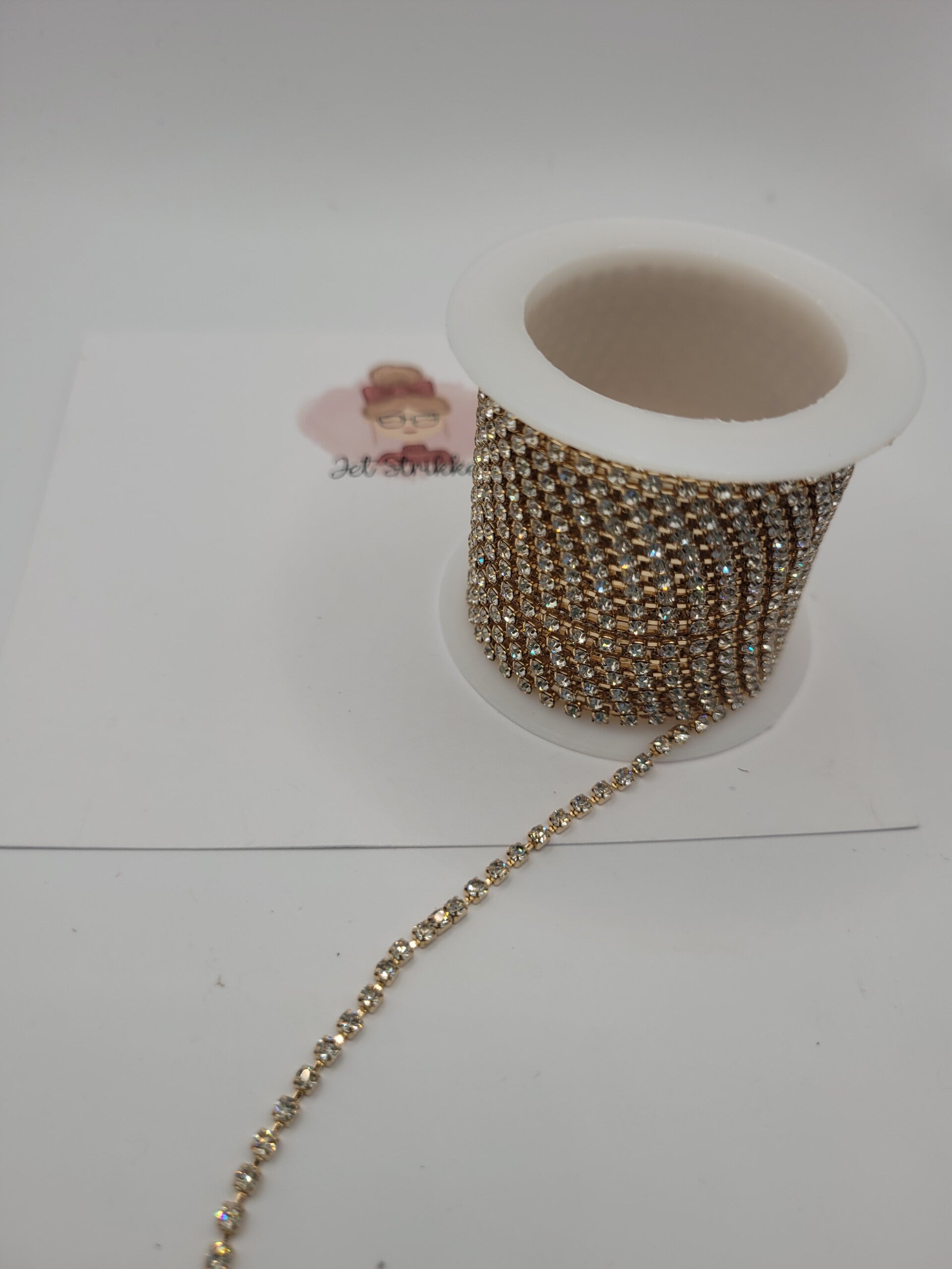 Rol strass ketting - goud / wit