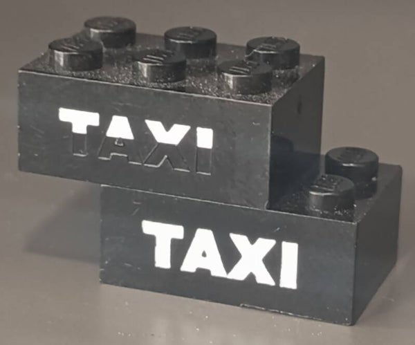 Taxi misprint brick