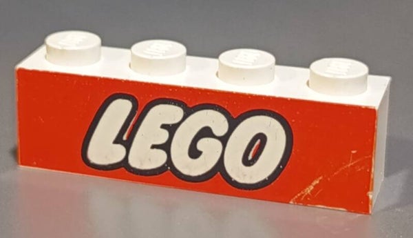 1x4 white brick with Lego logo