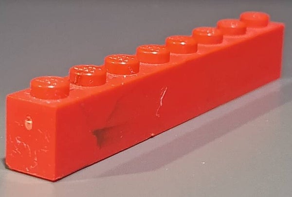 Red 1x8 brick marbled