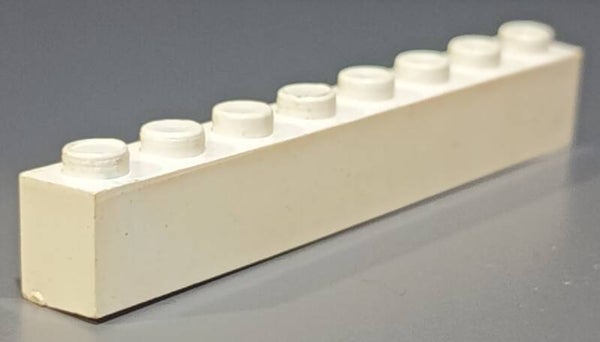 White 1x8 brick with a little marbled