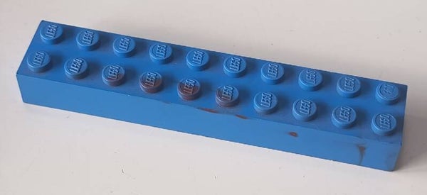 Blue 2 x 10 brick with some marbled