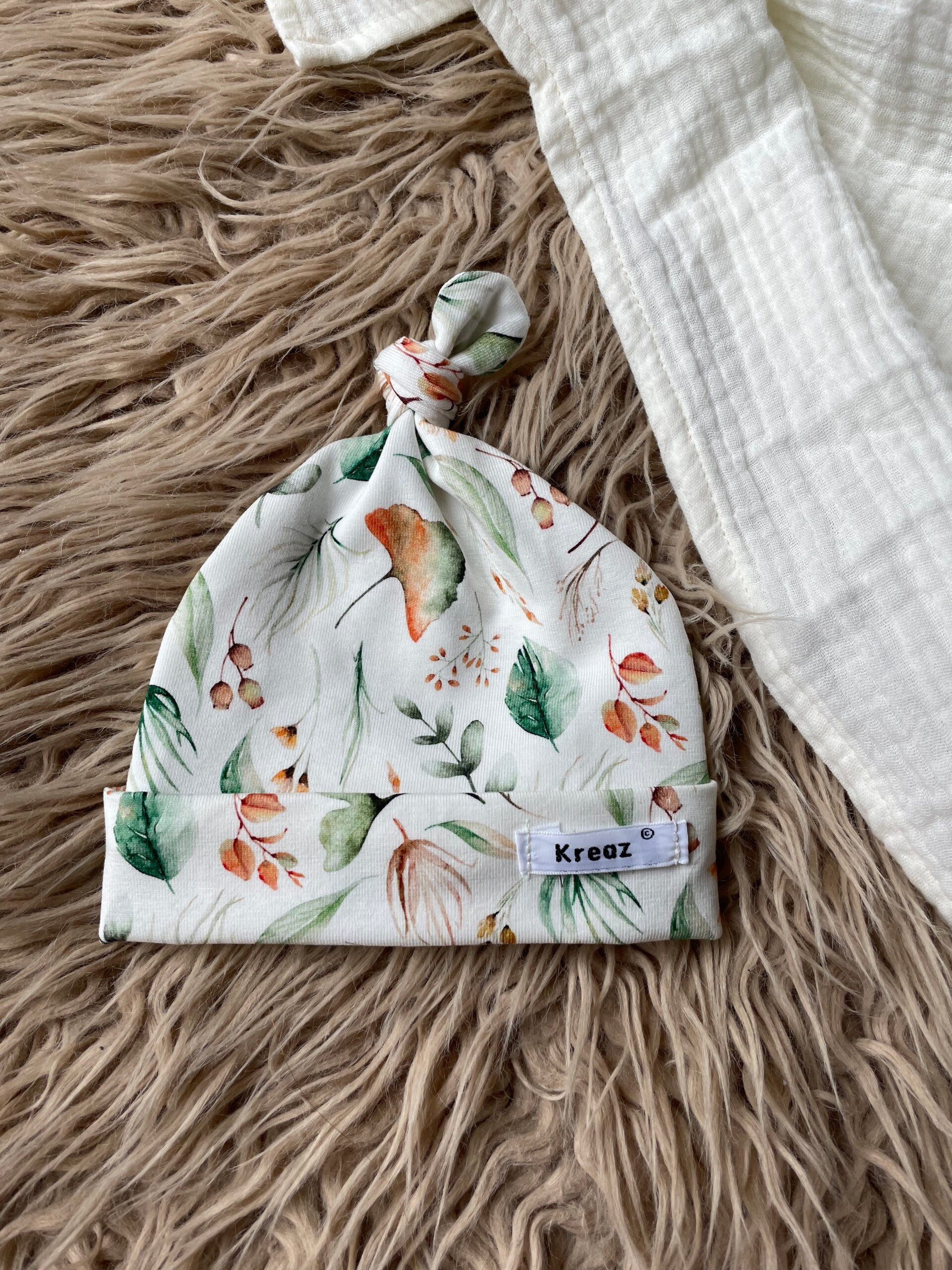 Knoopmutsje prema - herfstgroen