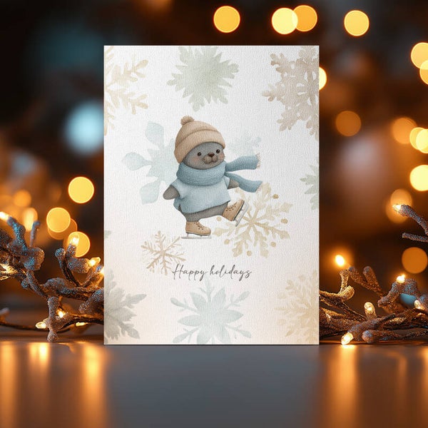 Kerstkaart zeehond schaatsen