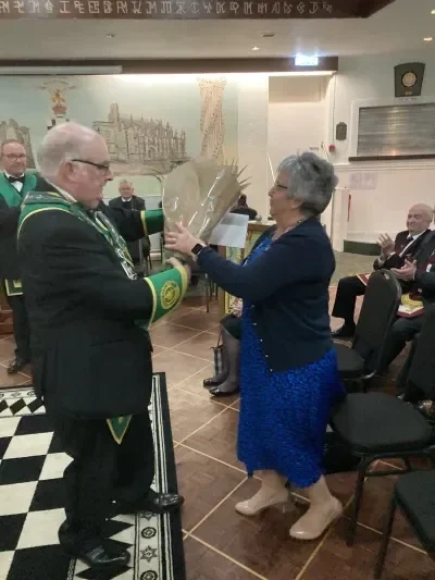 Chick's wife Anne receiving flowers