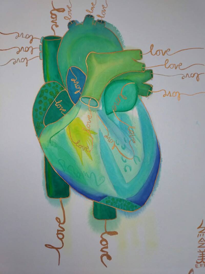 green anatomical heart with writing that reads "love"