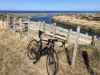 Picture of Wainuiomata river and beach with Tony Stallinger's bike in the foreground