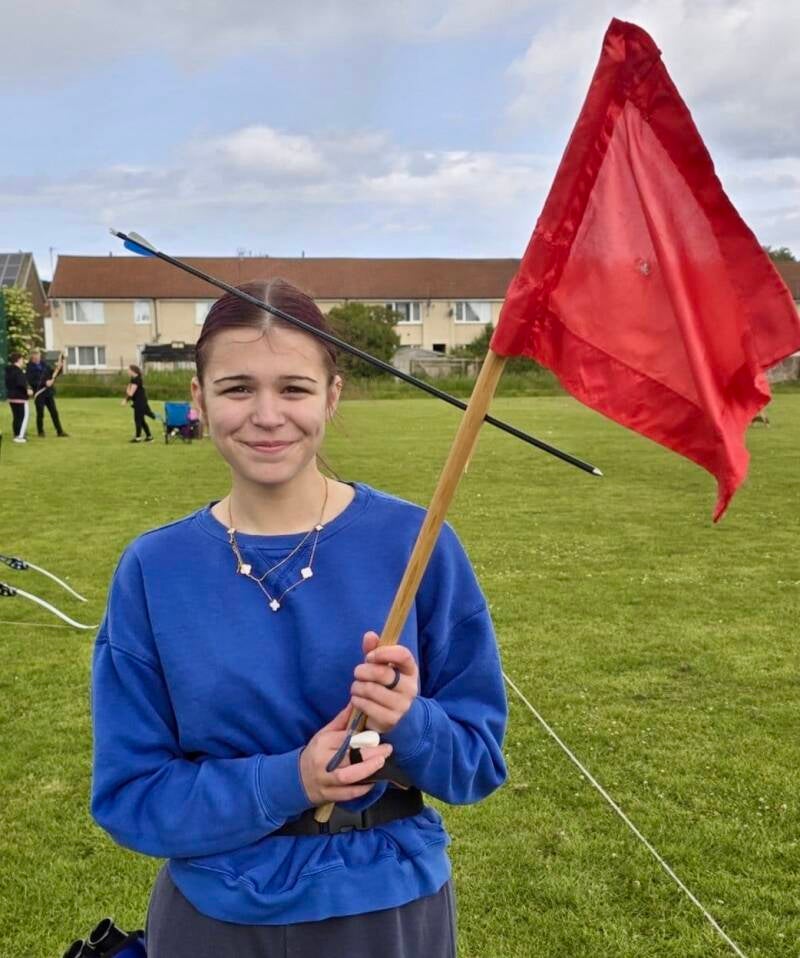 Emma shoots the wind flag by accident