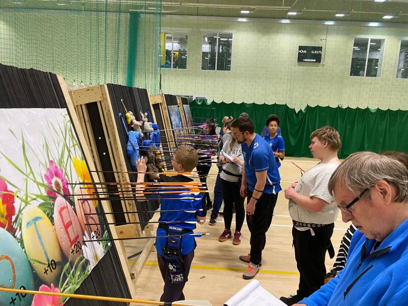 Members talyytheir shooting scores.