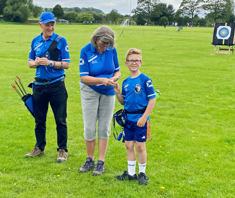Hugo Robson is awarded hi 252 archery badge for 20yds.