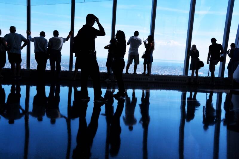 Backlit Silhouettes, People Looking at View from One World Trade Center Observatory, Manhattan New York City