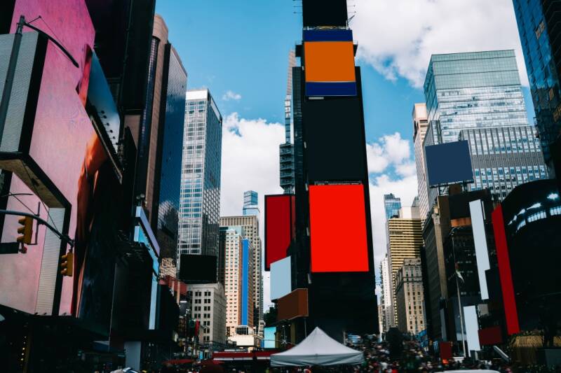 Famous Times square landmark with colourful mock up billboards on facades of modern skyscrapers buildings,high rise building lightbox with copy space for your advertising content or messages. 