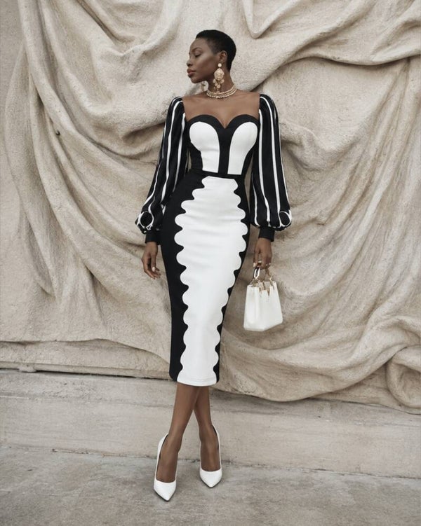 ROBE NOIRE ÉLÉGANTE MANCHES SCULTURALES