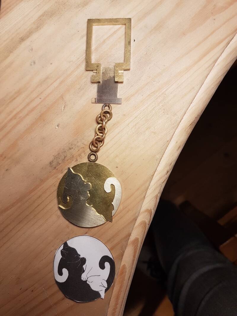 sierraden sleutelhanger met ying yang poes