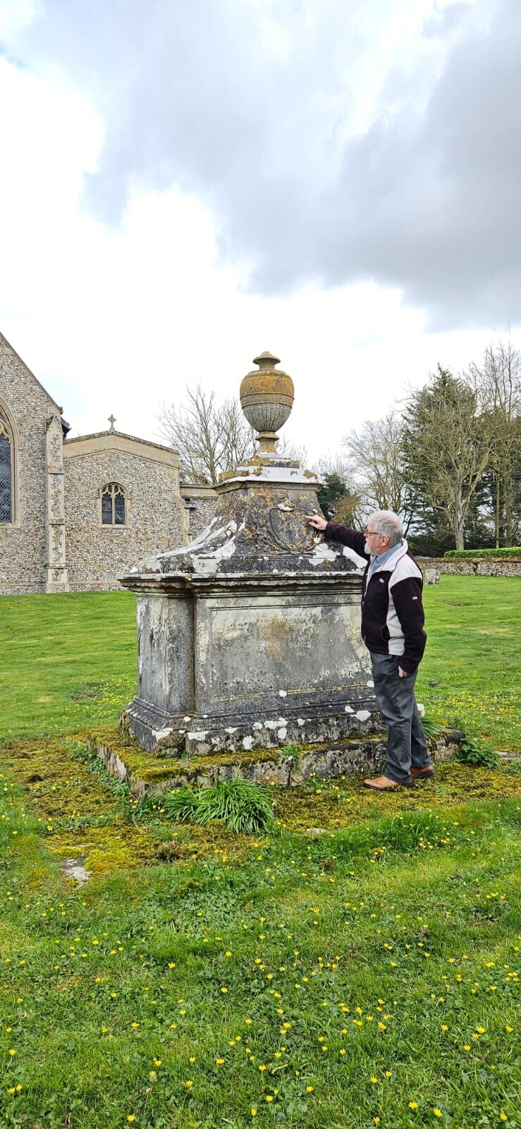 Glynn Burrows checking the Coat of Arms on a Georgian tomb in Norfolk