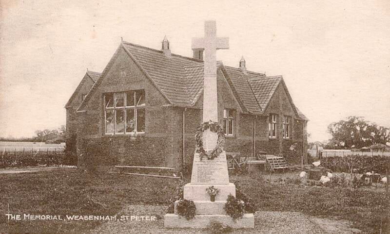 Historic black and white photograph of the Weasenham St. Peter war memorial in Norfolk, England.