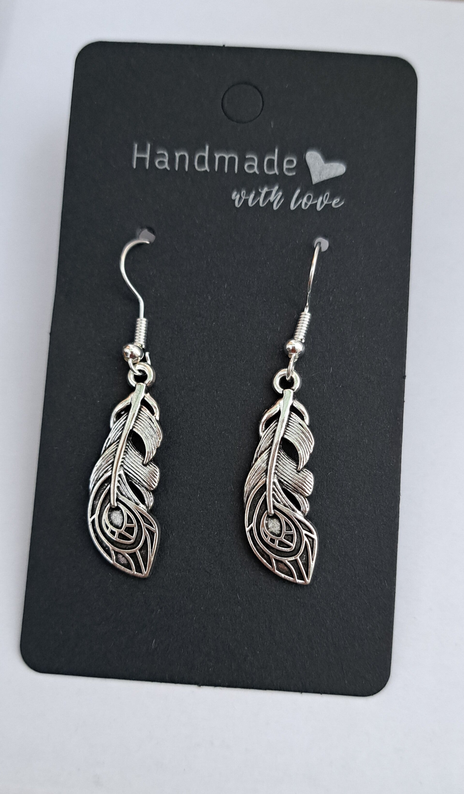 Handmade ornate feather drop earrings