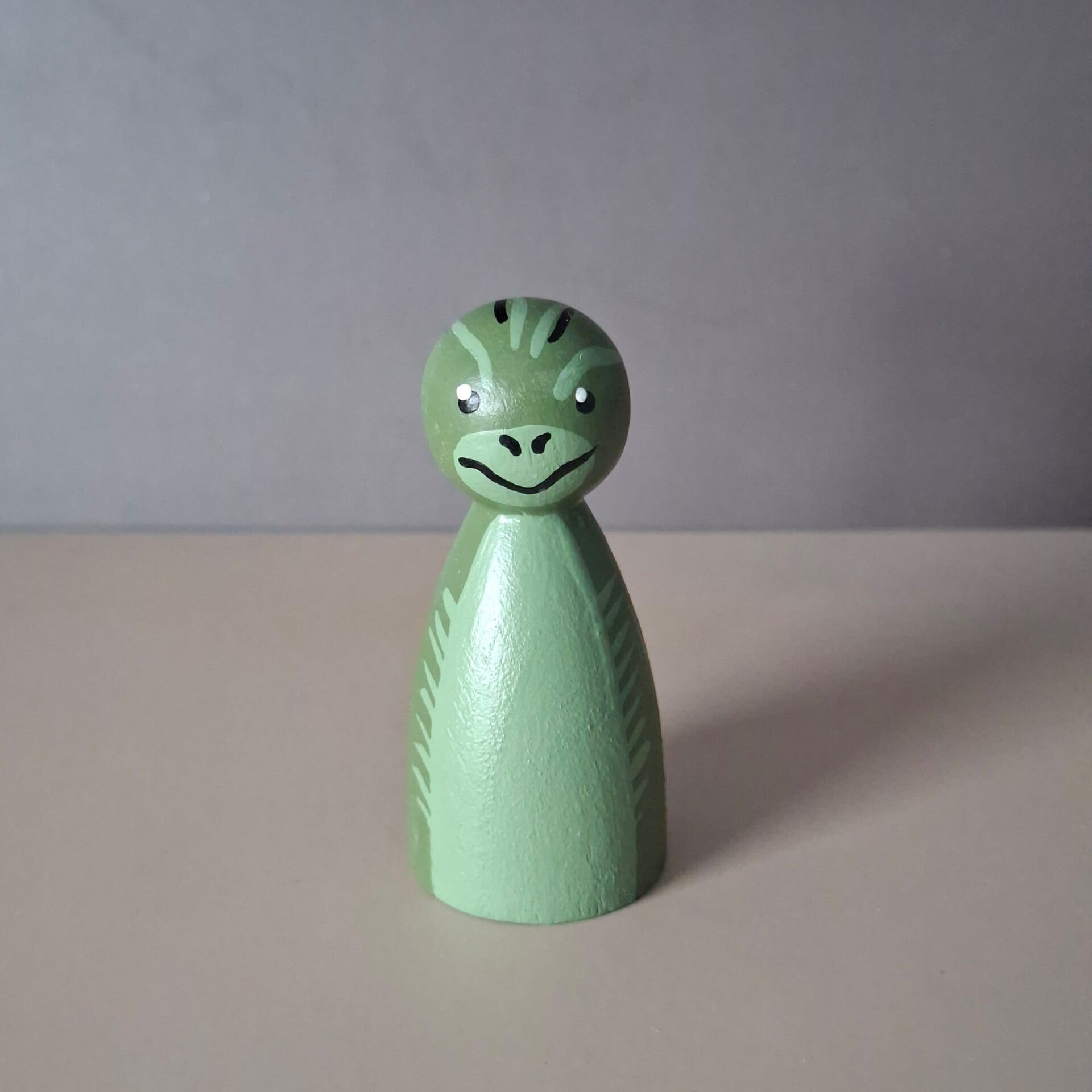Peg doll dino stegosaurus groen