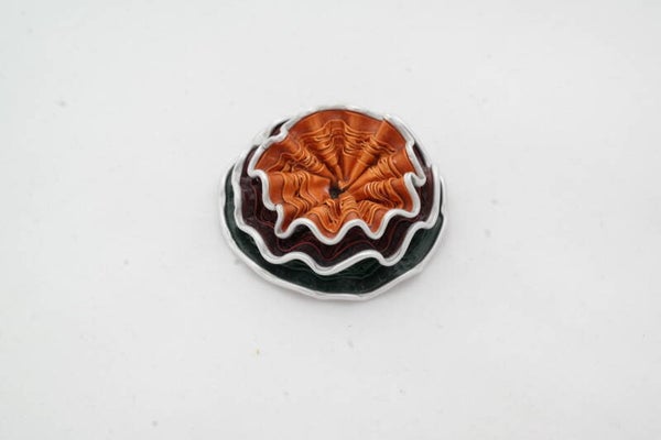 kleine broche oranje