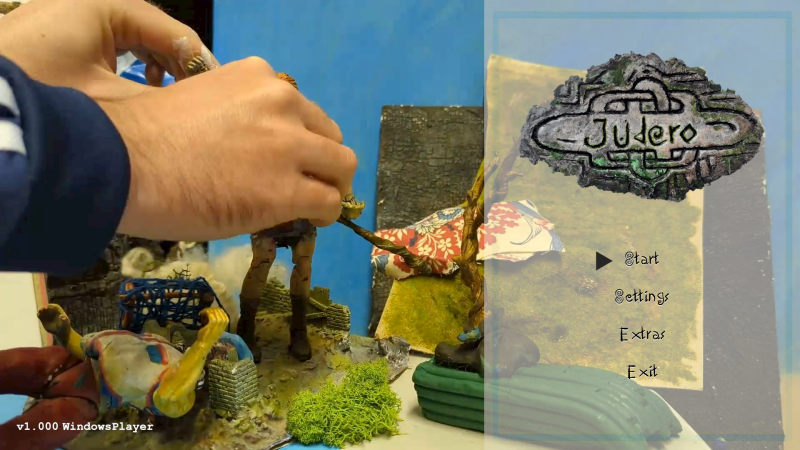 Image of he creator of Judero hands, moving the main character on the start-up menu.