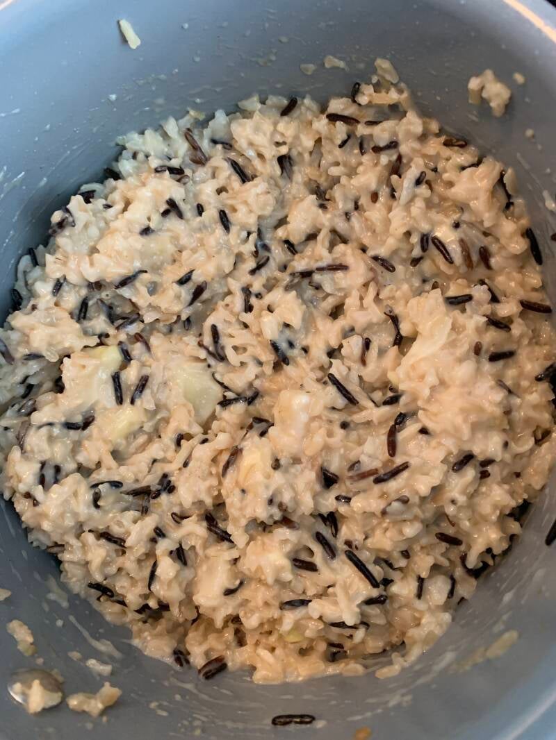 A bowl of warm, creamy Cannabis Cheese Wild Rice, a comfort food favorite for cannabis edibles and stoner strategies enthusiasts