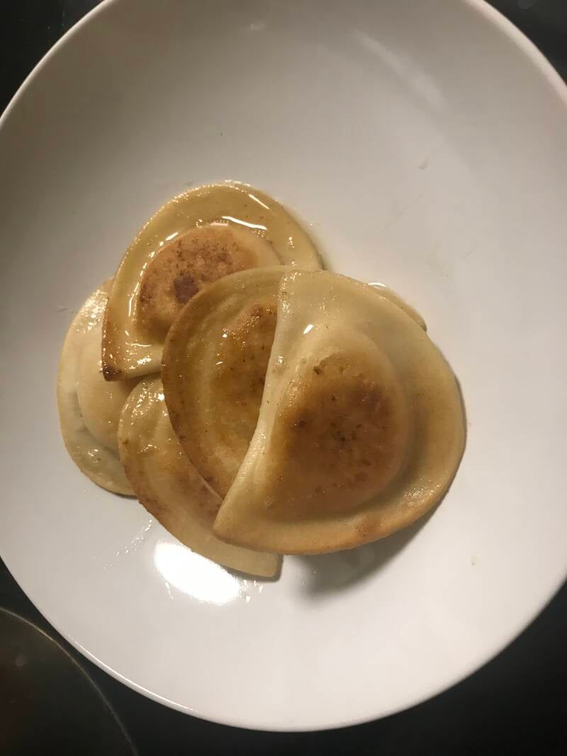 A plate of golden, crispy Pan-Fried Cannabis Pierogis, perfect for cannabis edibles and Stoner Strategies enthusiasts