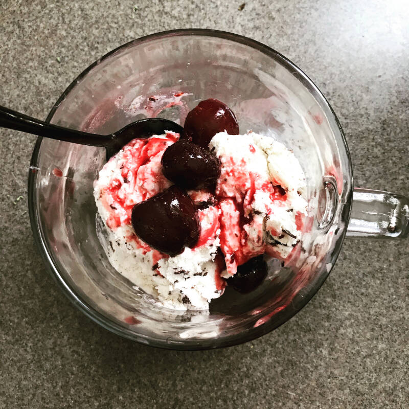 bowl of glistening Cannabis Cherry Honey Sauce, perfect for cannabis edibles and stoner strategies enthusiasts.