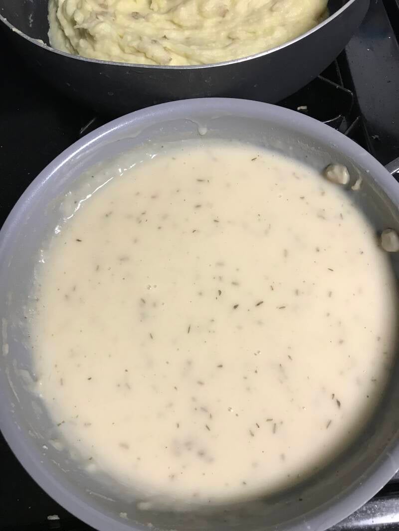 A rich, creamy bowl of Chicken and Herb Cannabis Gravy, perfect for cannabis edibles and stoner strategies enthusiasts.